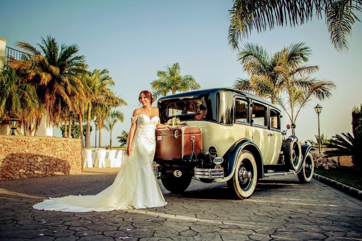 Bride with antique car